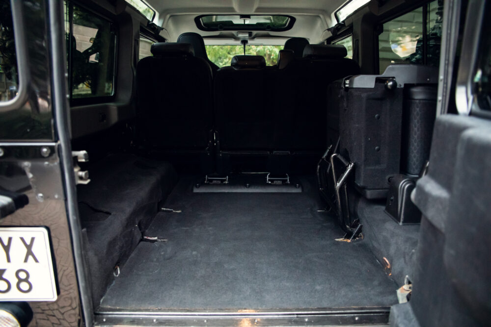 Spacious SUV rear interior with folded seats.