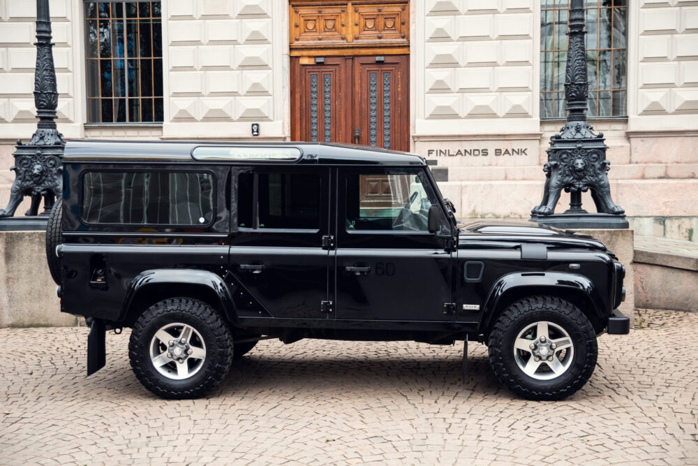 Black Land Rover Defender parked outside Finland's Bank.