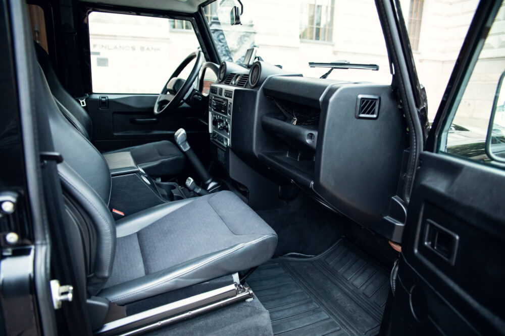 Interior view of a modern SUV with open doors.