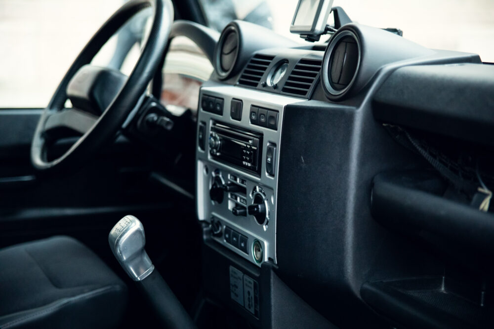 Interior of modern car with dashboard and steering wheel.