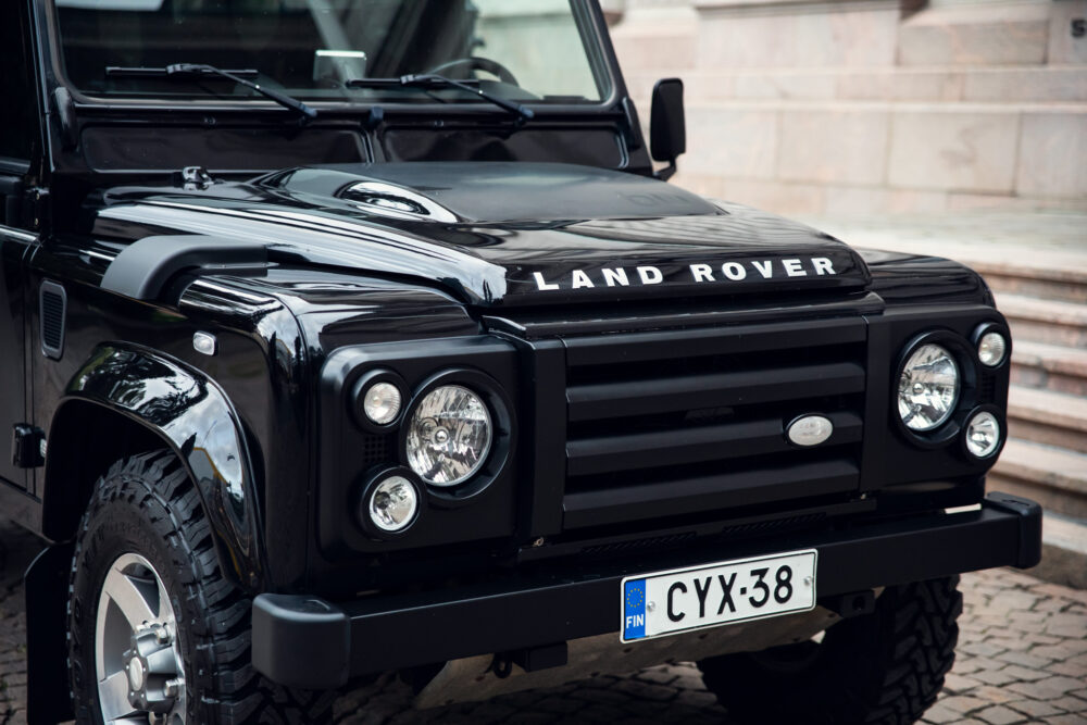 Black Land Rover Defender, close-up, European license plate.