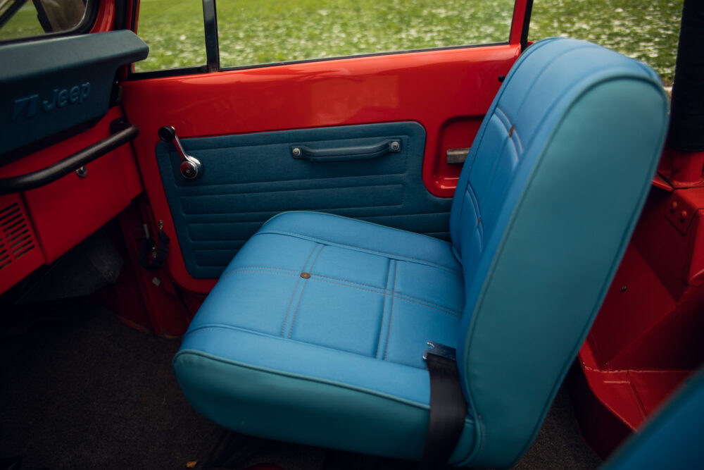 Vintage red Jeep, blue interior seat