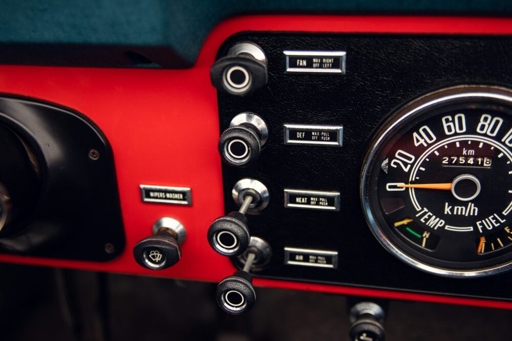 Vintage car dashboard with gauges and control knobs