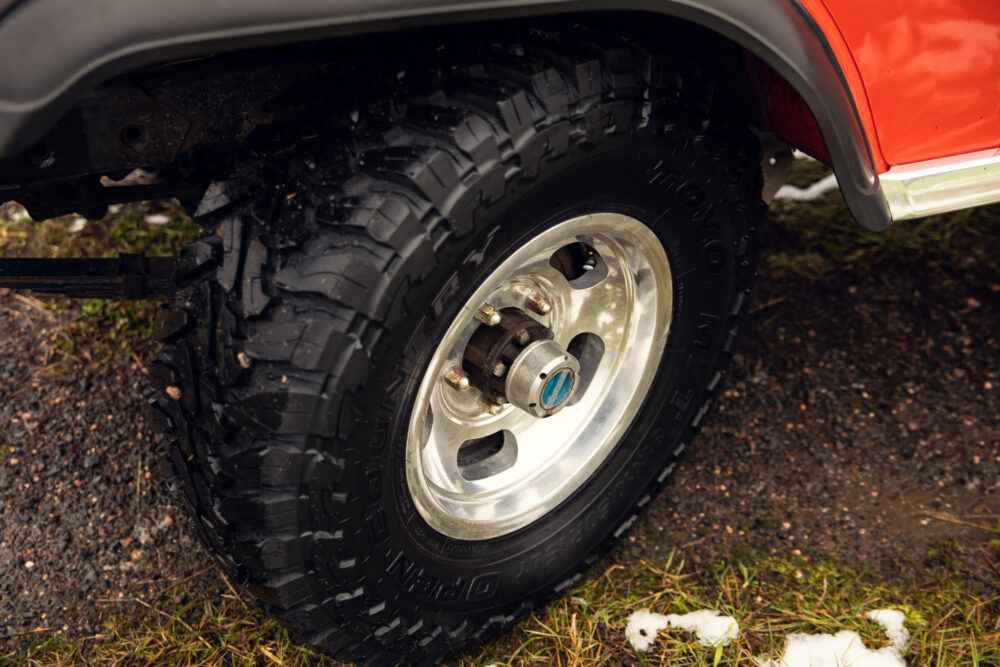 Close-up of vehicle tire on muddy terrain