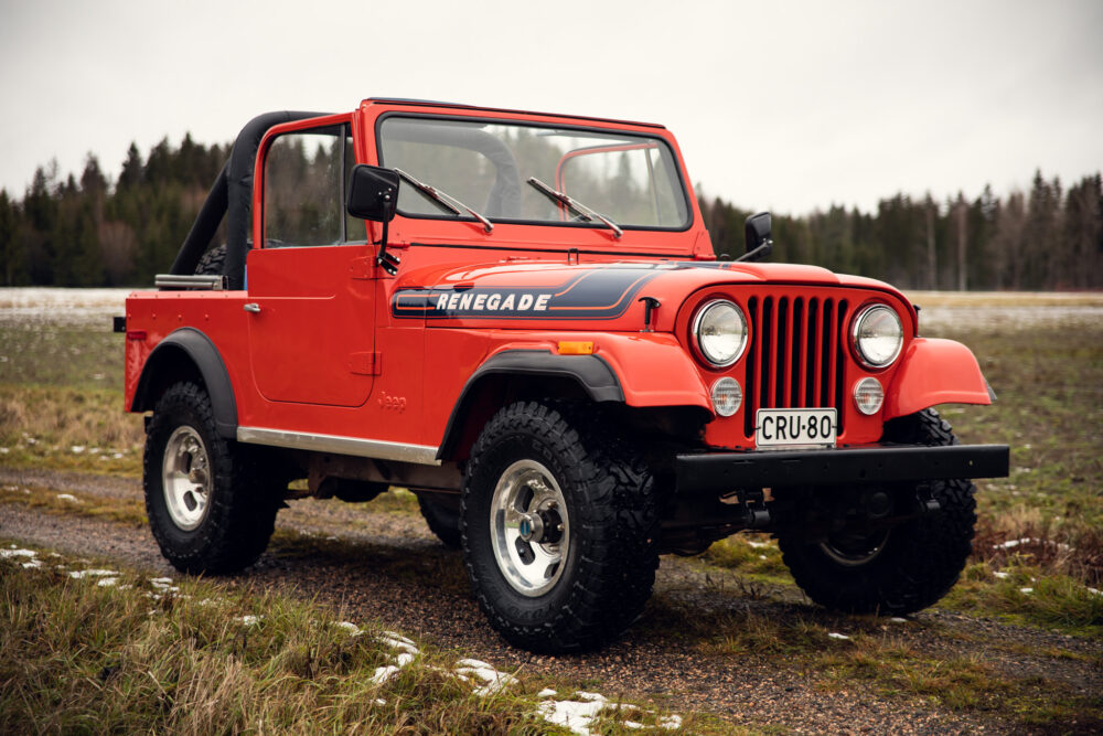 Red vintage Jeep Renegade parked outdoors