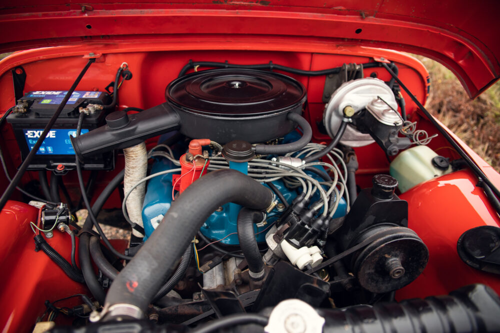 Detailed view of vintage red car engine compartment