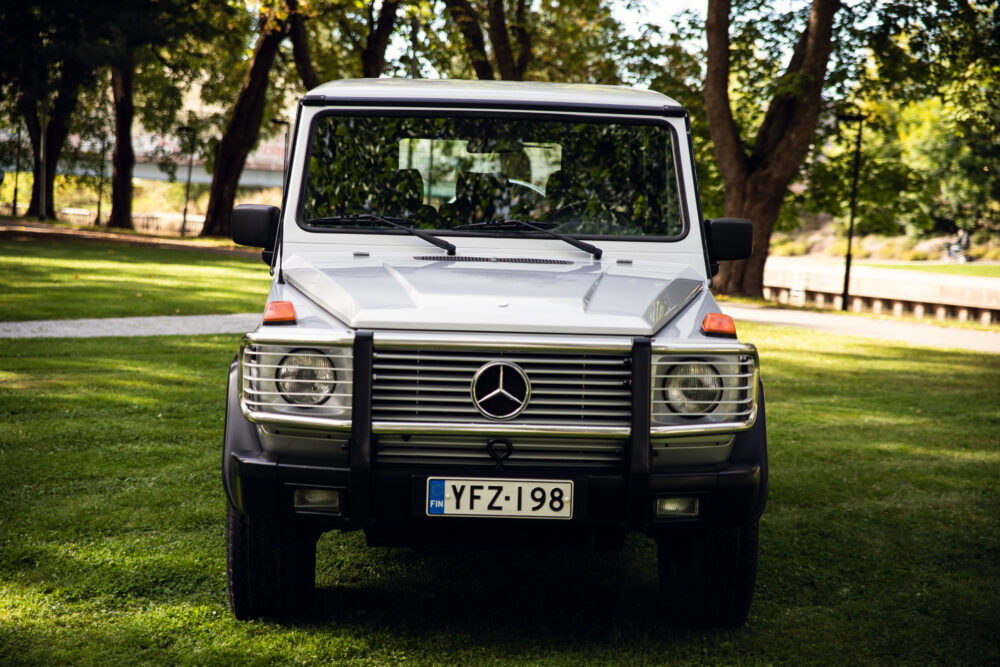 Mercedes Benz G-Class SUV parked in lush green park