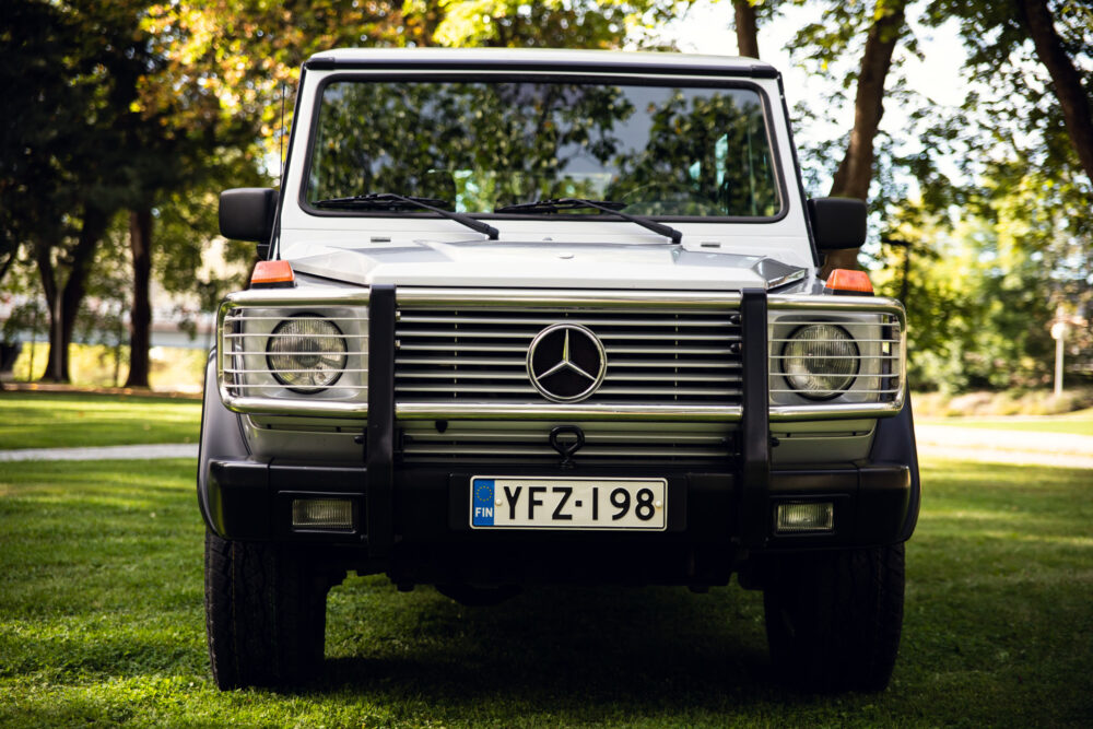 Mercedes-Benz G-Class SUV parked in lush green park