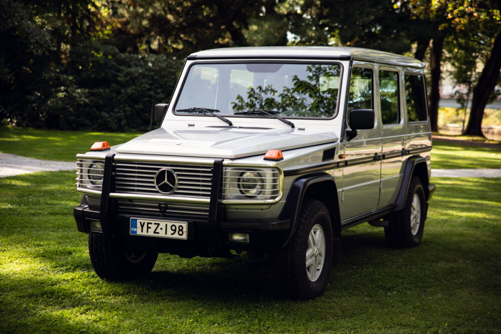 Vintage Mercedes SUV parked on grass