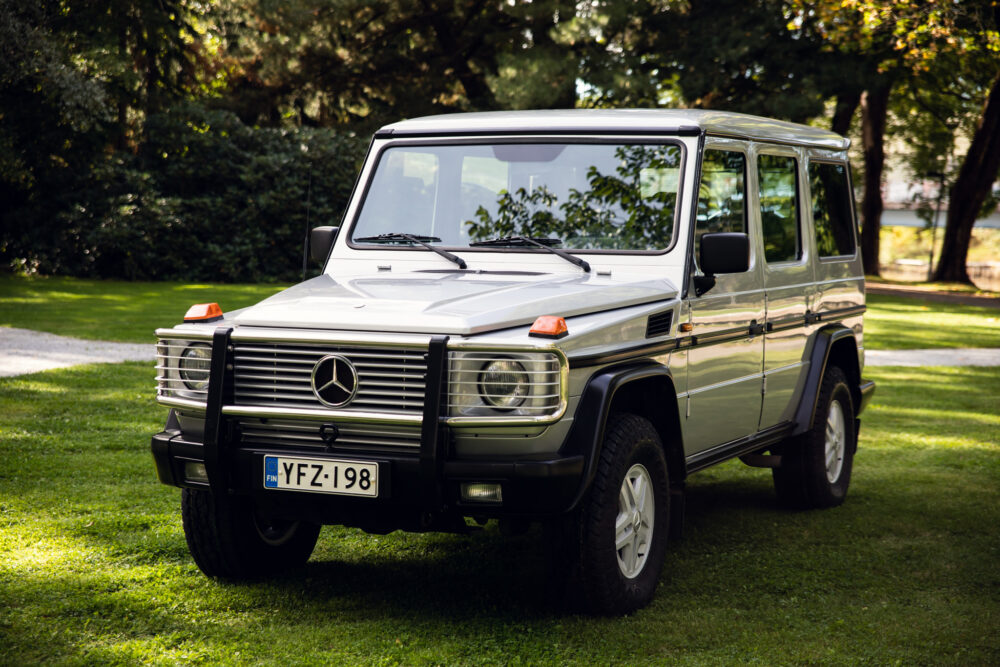 Vintage Mercedes SUV parked on grass