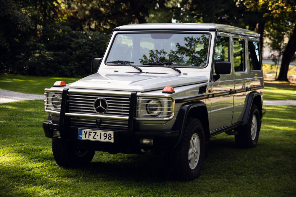 Silver Mercedes-Benz G-Class SUV parked on grass