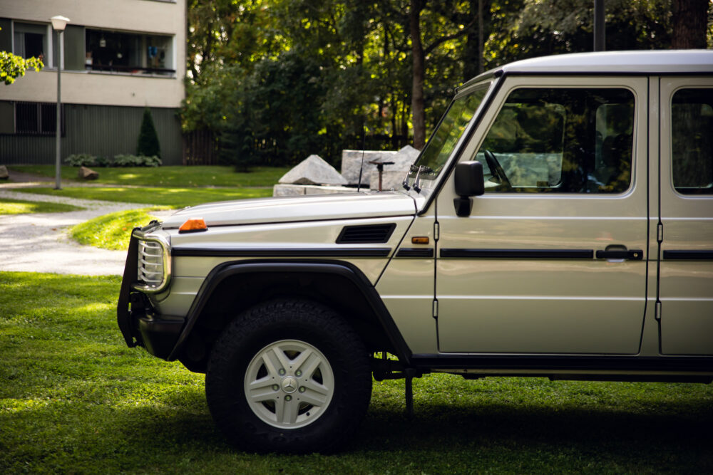 Beige SUV parked outdoors near trees