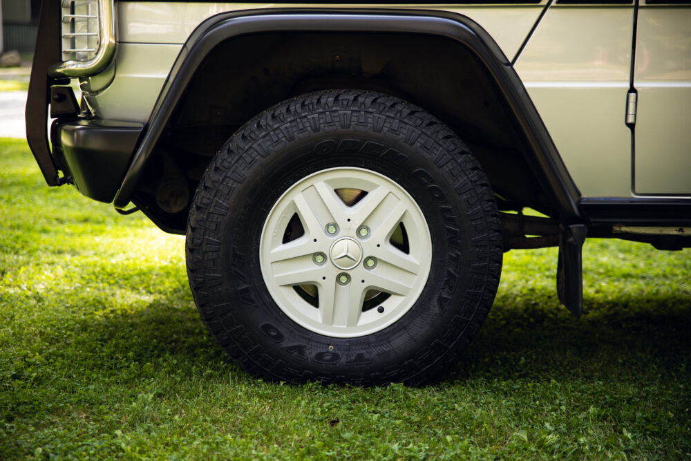 Mercedes SUV tire on grass