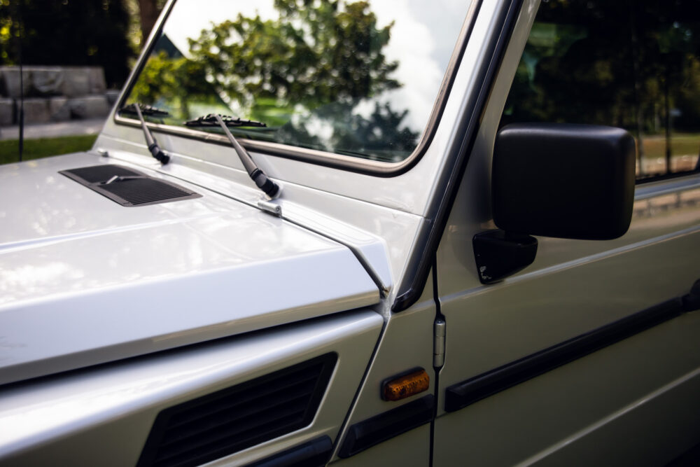 Close-up of vintage car's front side and windshield