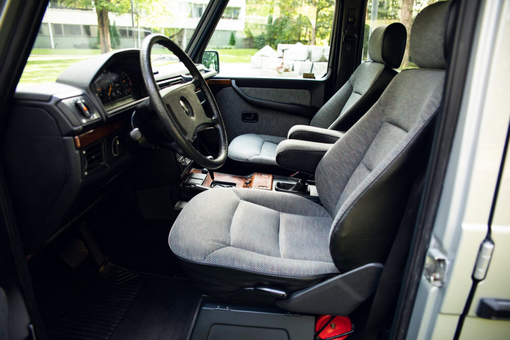 Interior view of a vintage car with fabric seats