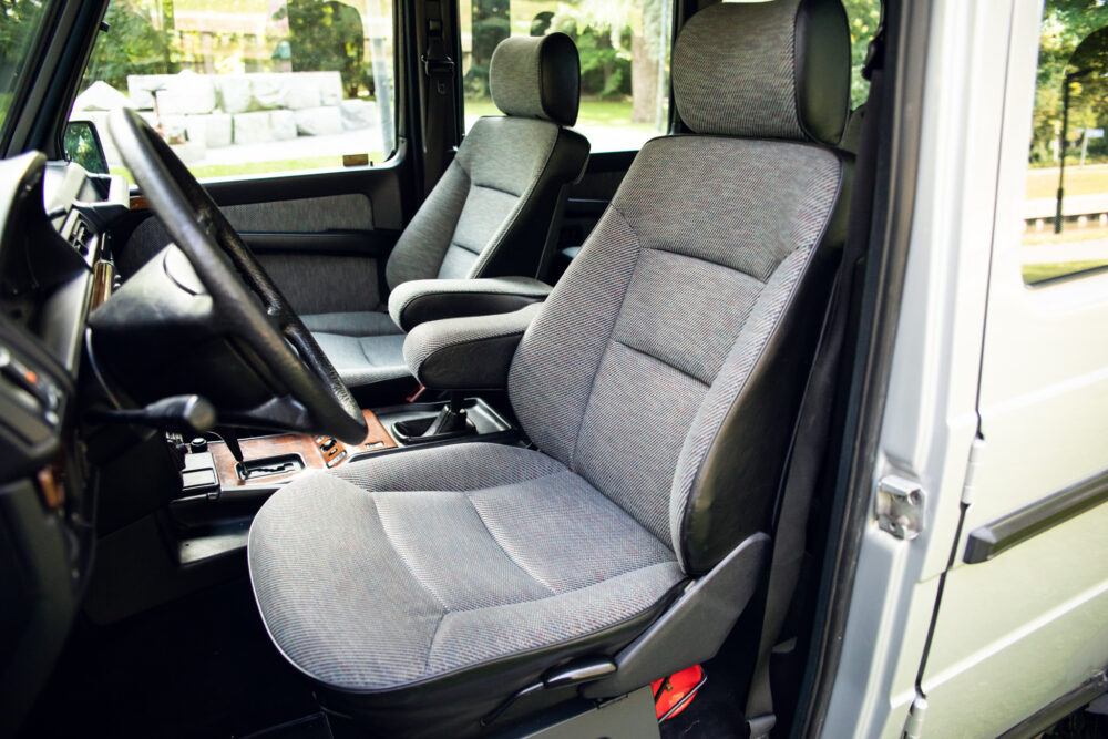 Interior view of an empty van with fabric seats