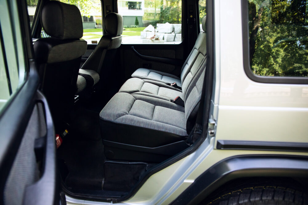 Open SUV door showing clean, spacious back seats