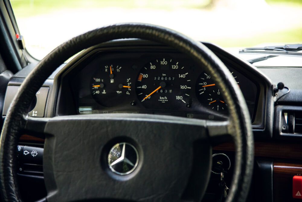 Close-up view of classic car dashboard and steering wheel