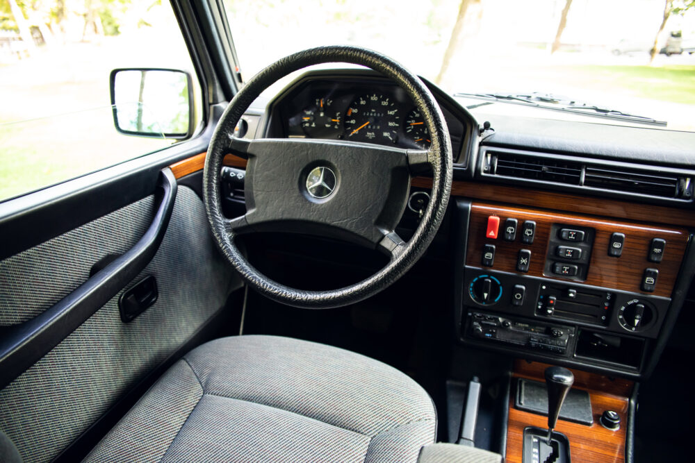 Vintage car interior with steering wheel and dashboard