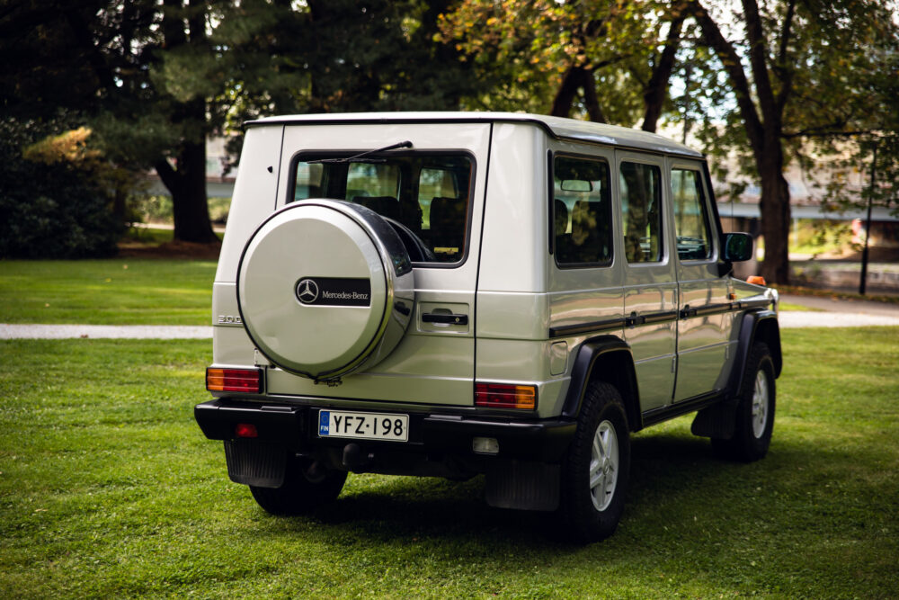 Mercedes-Benz G300 SUV parked on lush green grass