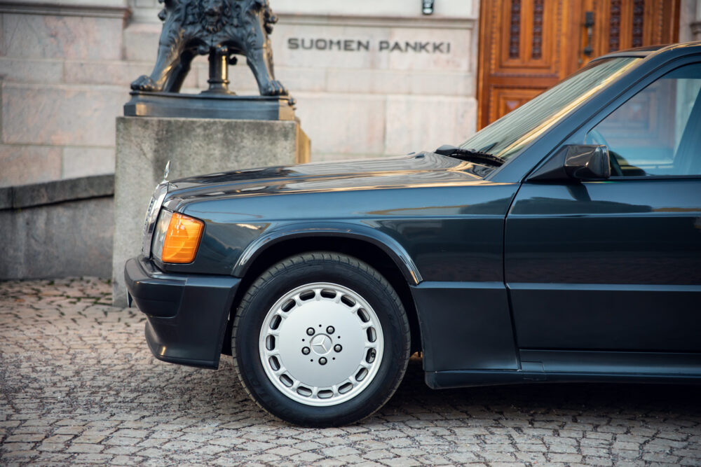 Vintage Mercedes car parked near ornate building