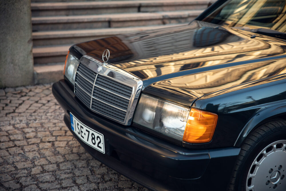 Vintage Mercedes car parked on cobblestone street