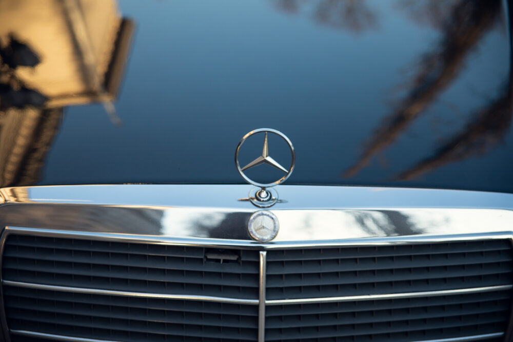 Mercedes hood ornament and grille with reflections