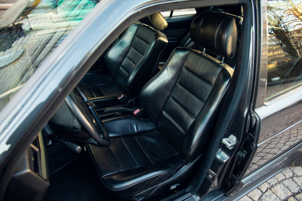 Open car door showing clean black leather interior