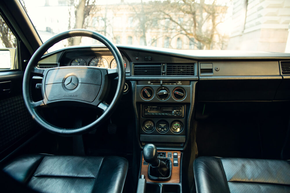 Vintage Mercedes interior with steering wheel and dashboard