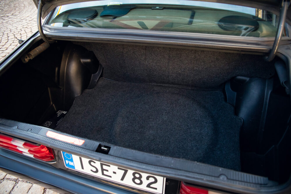 Empty car trunk with European license plate visible