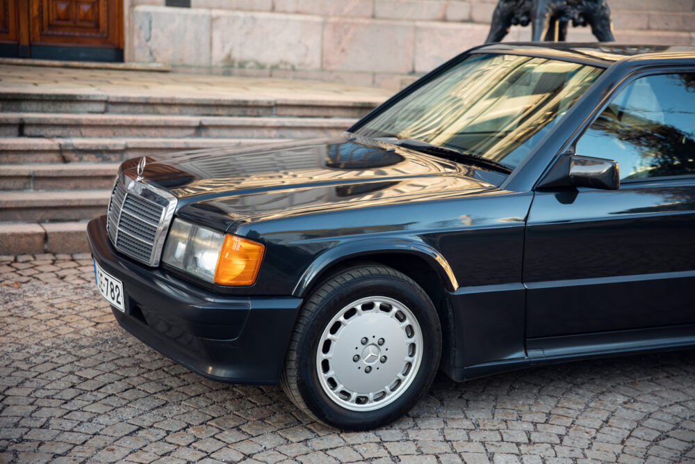 Vintage black Mercedes parked by stone steps