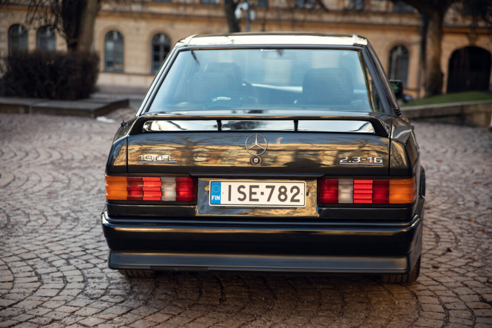 Vintage Mercedes-Benz 190E on cobblestone street