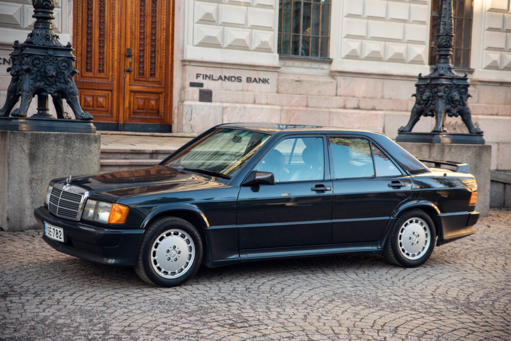 Vintage black Mercedes-Benz parked in front of building