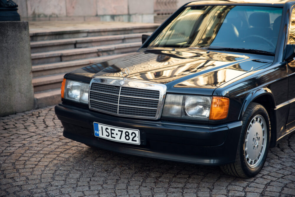 Vintage Mercedes car parked on cobblestone street