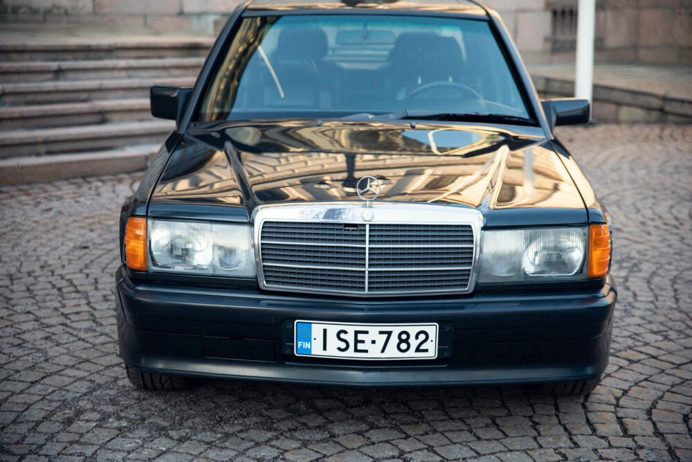 Vintage Mercedes-Benz car parked on cobblestone street