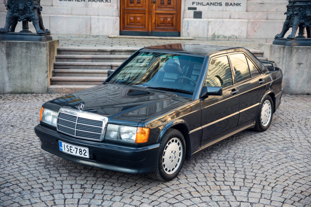 Vintage Mercedes-Benz parked outside historical building