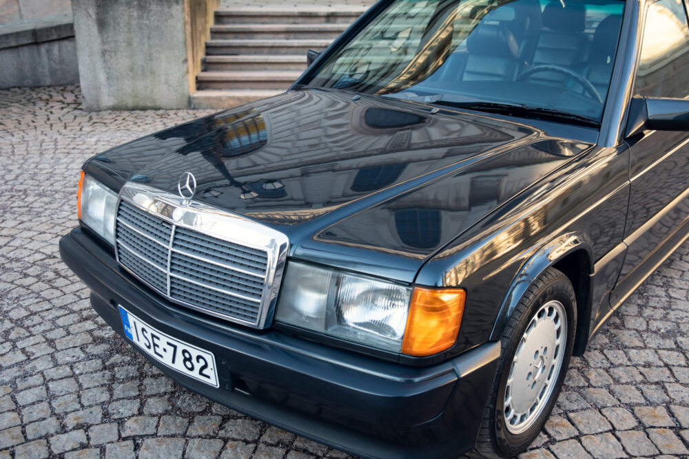 Vintage Mercedes-Benz car parked on cobblestone street