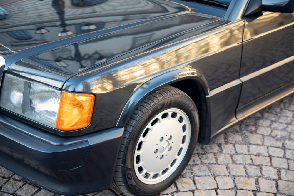 Close-up of vintage car's front end and wheel