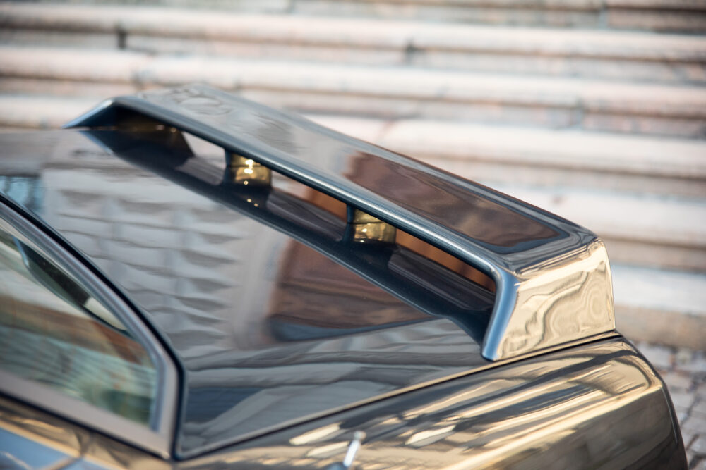 Close-up of car roof with reflective spoiler