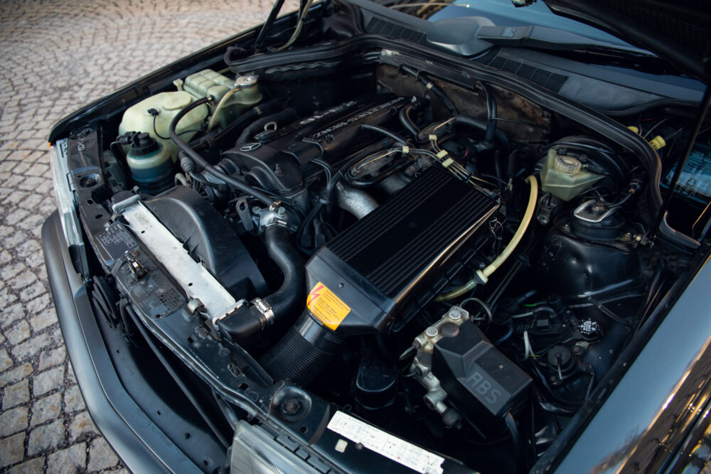 Detailed view of open car engine compartment