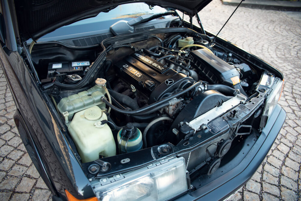 Open hood showing Mercedes-Benz car engine