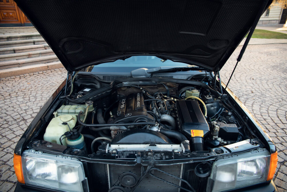 Open car hood showing detailed engine compartment