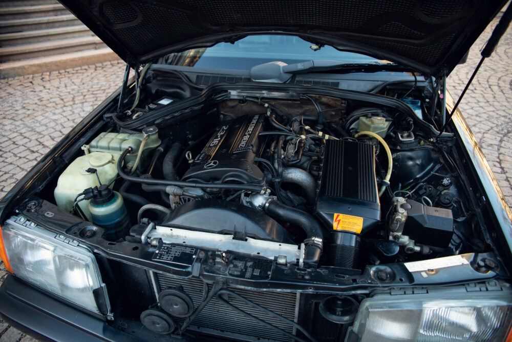 Open car hood showing detailed engine compartment