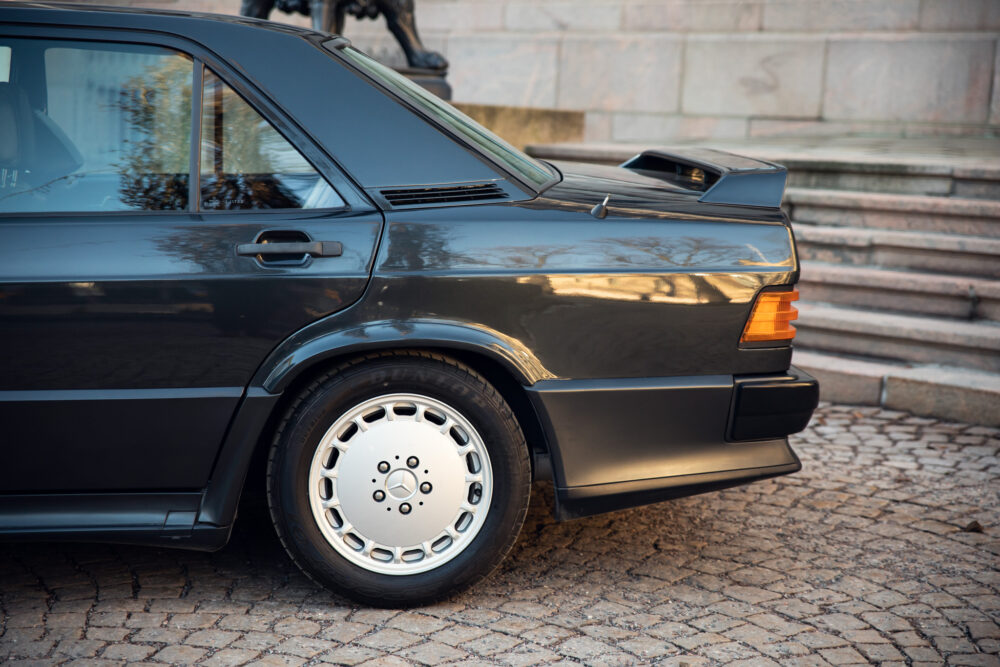 Vintage black Mercedes-Benz parked on cobblestone street