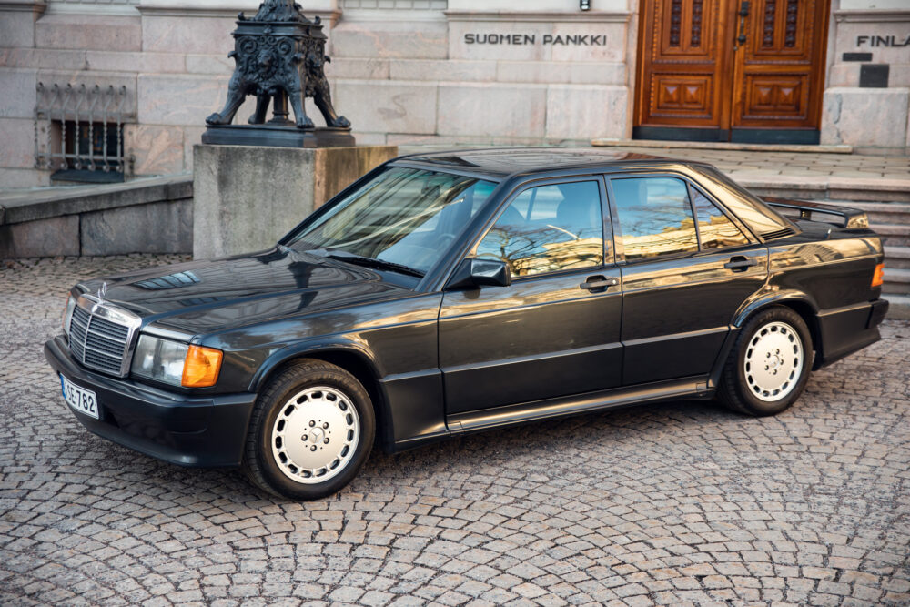 Vintage black Mercedes-Benz parked near historic building