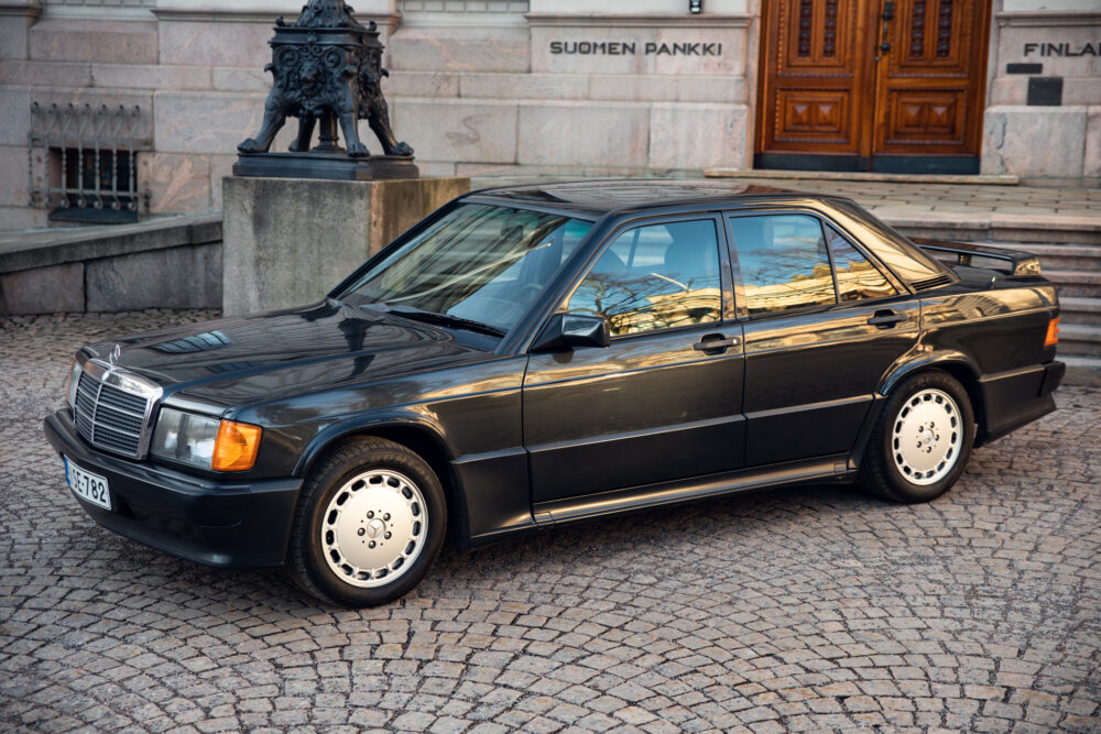 Vintage black Mercedes-Benz parked near historic building