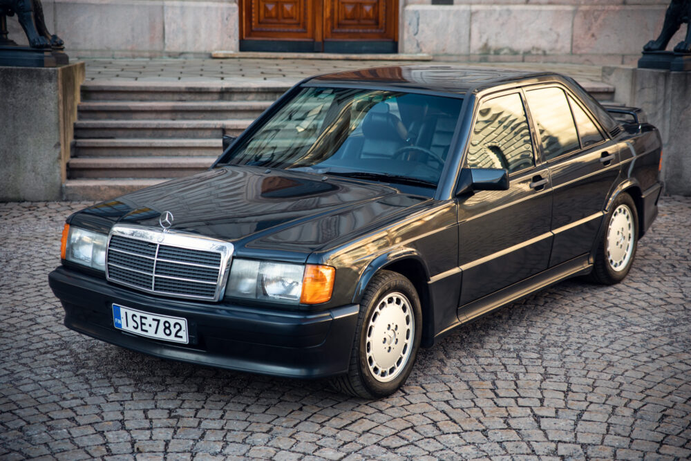 Vintage black Mercedes parked on cobblestone street