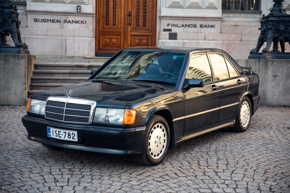 Vintage Mercedes-Benz car parked in front of bank