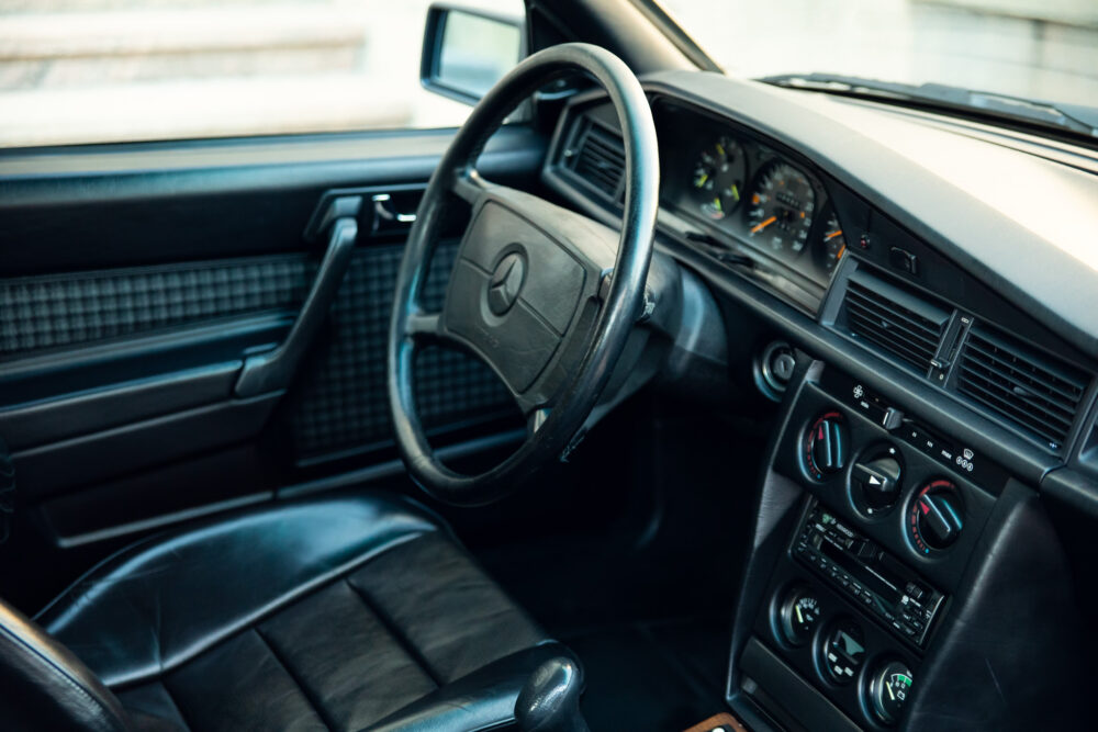 Vintage Mercedes-Benz interior with steering wheel and dashboard