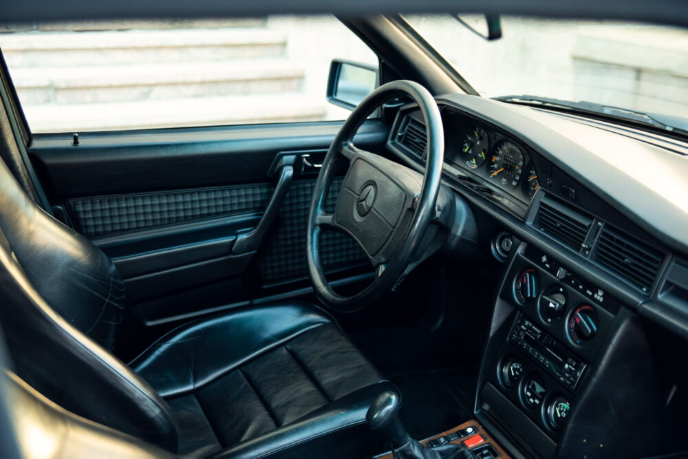 Vintage car interior with classic steering wheel and dashboard